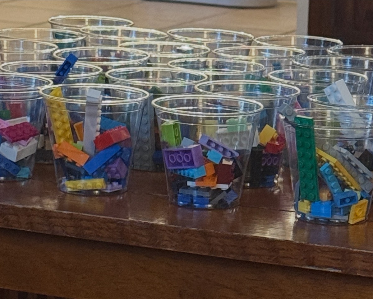 A closer look at the cups of Legos, each one a little grab bag of building possibilities